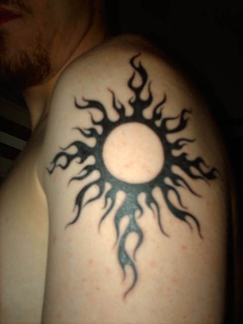 Black Tribal Sun Tattoo On Man Shoulder