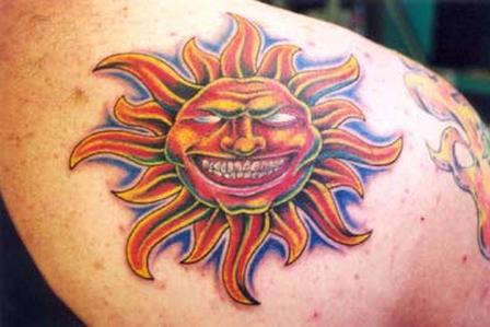 Colorful Laughing Sun Tattoo On Back Shoulder