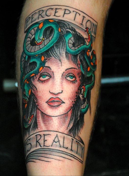 Colorful Medusa Face With Banner Tattoo On Forearm