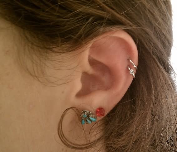 Dual Lobe And Dual Helix Piercing On Left Ear