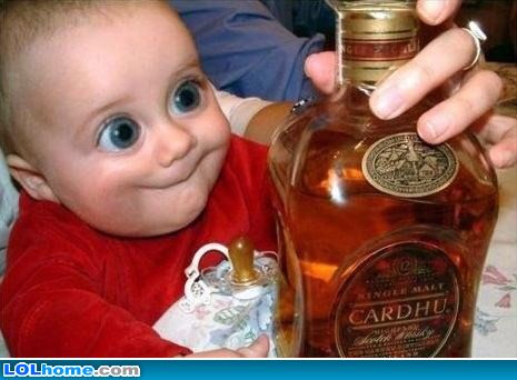 Funny Kid Happy To Looking Alcohol Bottle