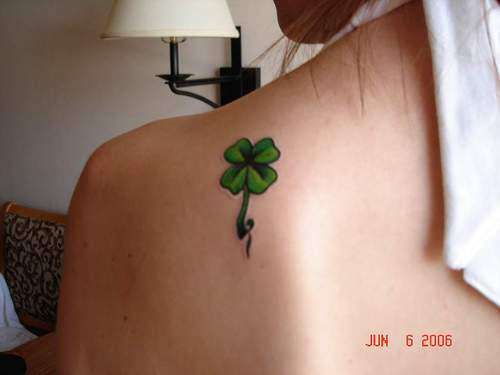 Green Clover Leaf Tattoo On Girl Left Back Shoulder