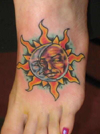Half Moon In Sun Tattoo On Girl Foot