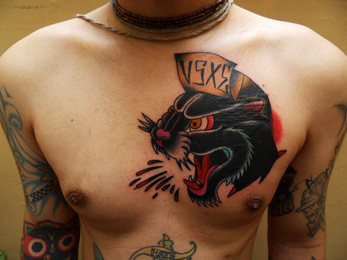 Read Complete Panther Head Tattoo On Man Left Chest