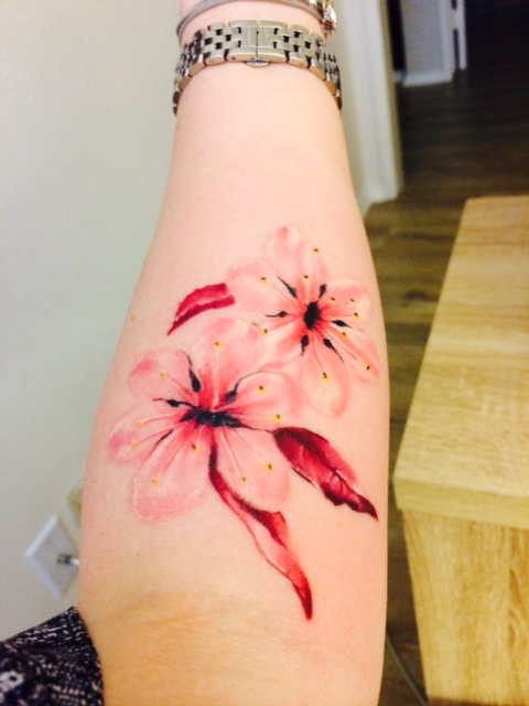 Pink Two Cherry Blossom Tattoo On Girl Forearm