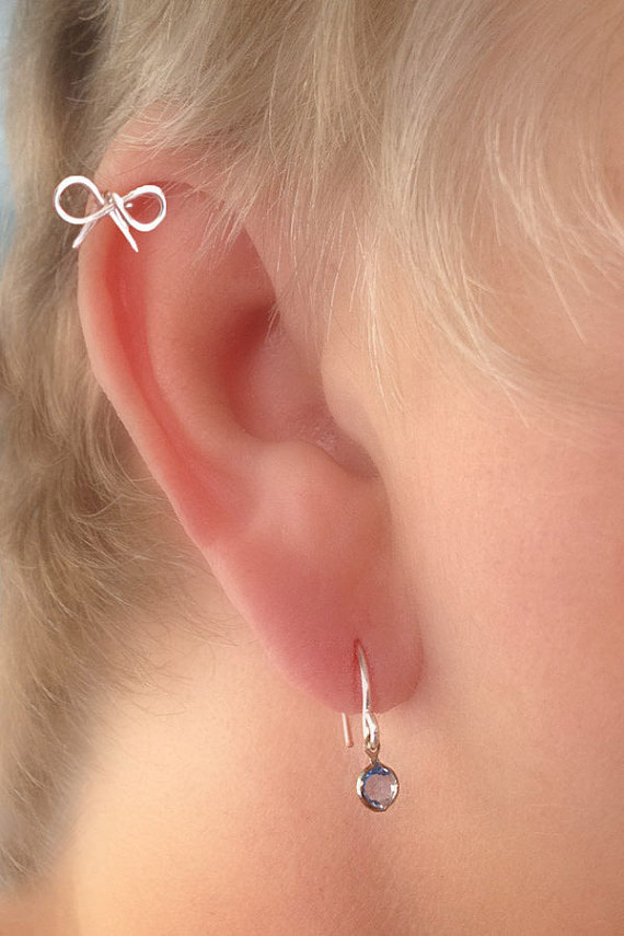 Right Ear Lobe And Helix Piercing For Young Girls
