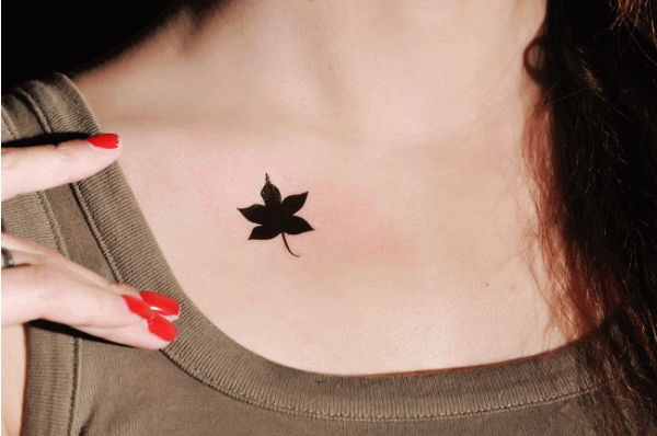 Silhouette Maple Leaf Tattoo On Girl Chest