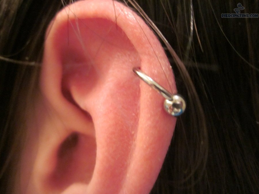 Silver Ball Ring Helix Piercing On Left Ear