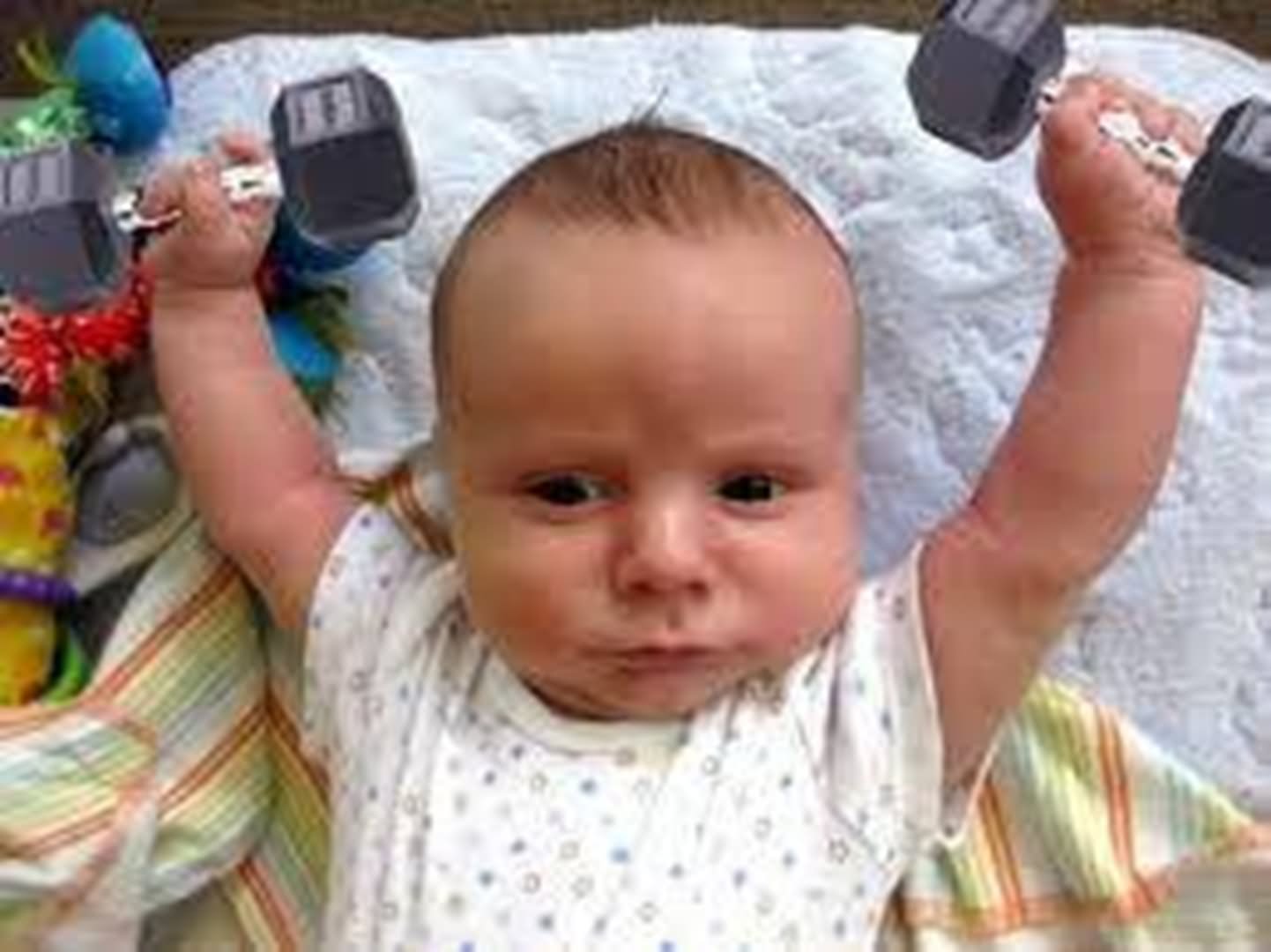 Weight Lifting Baby And Making Funny Face