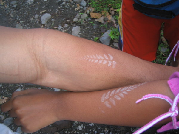 White Fern Leaf Tattoo On Couple Forearm