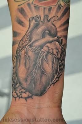 Amazing Black And Grey Real Heart Tattoo On Wrist
