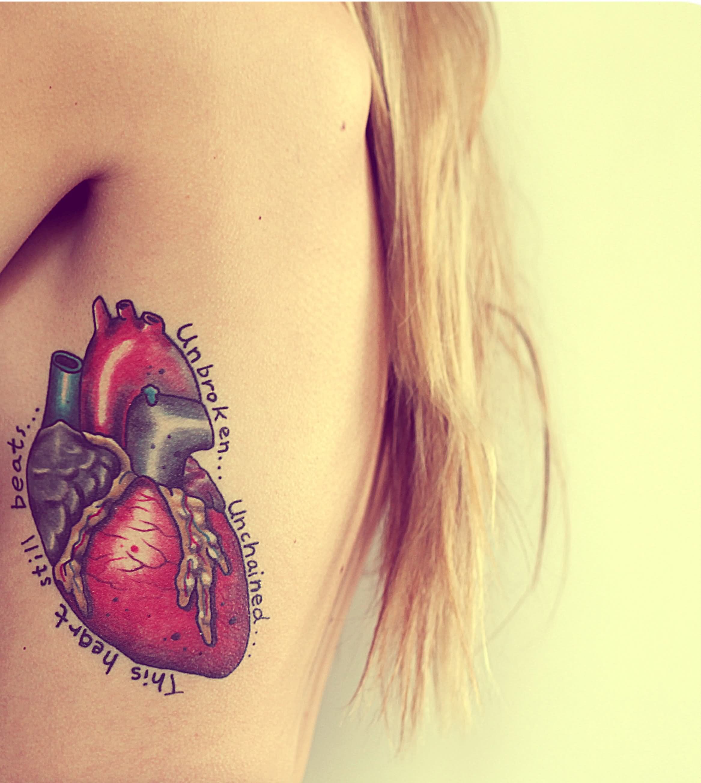 Amazing Colorful Heart Tattoo On Girl Upper Side Rib