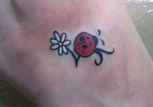 Amazing Ladybirds On Flower Tattoo Design