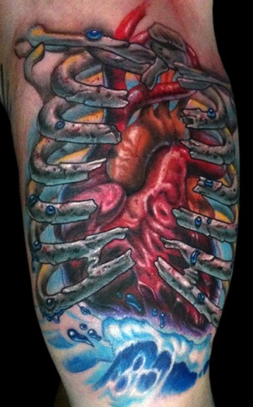 Amazing Real Heart In Rib Cage Tattoo Design