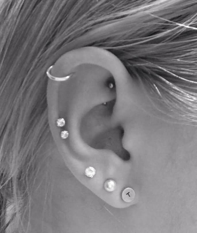 Beautiful Right Ear Cartilage Piercing With Diamond Studs