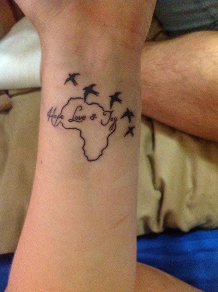 Black African Map Outline With Flying Birds Tattoo On Wrist