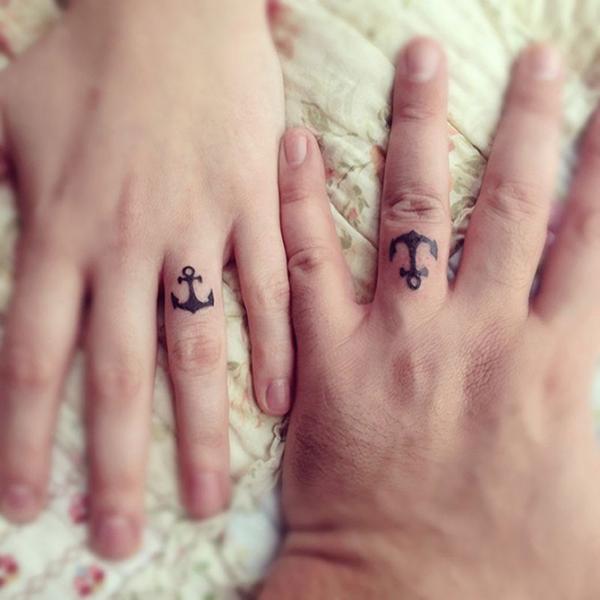 Black Anchor Ring Tattoo On Couple Finger