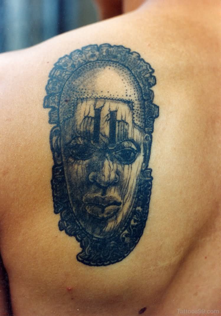Black And Grey 3D African Mask Tattoo On Man Left Back Shoulder By Deborah Valentine