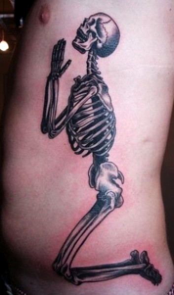 Black And Grey 3D Praying Skeleton Tattoo On Man Side Rib