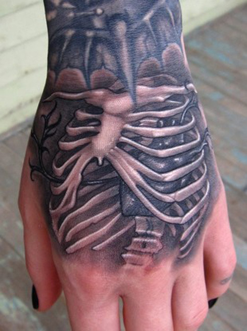 Black And Grey 3D Rib Skeleton Tattoo On Girl Hand