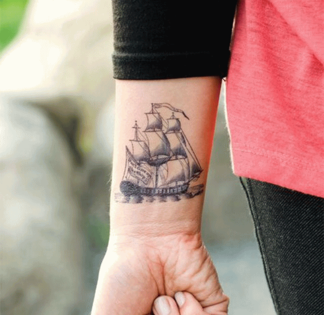 Black And Grey Boat Tattoo On Wrist By Zelma