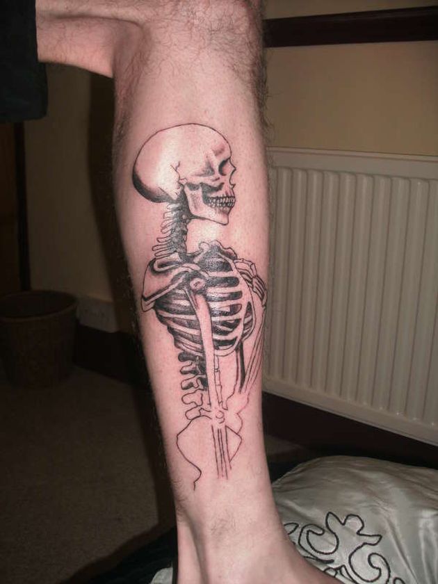 Black And Grey Half Human Skeleton Tattoo On Leg