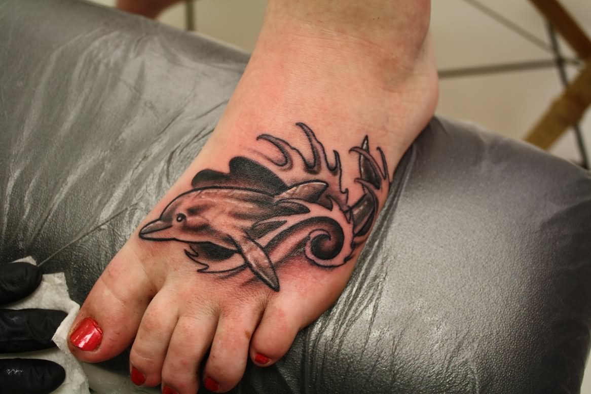 Black And Grey Ripped Skin Dolphin Tattoo On Girl Foot