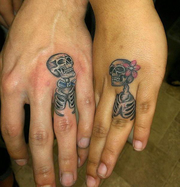 Black And Grey Skeleton Ring Tattoo On Couple Finger
