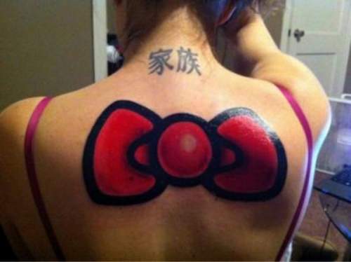 Black And Red Bow Tattoo On Girl Upper Back