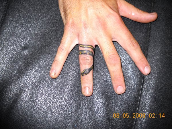 Black And Yellow Snake Ring Tattoo On Finger By Kitty