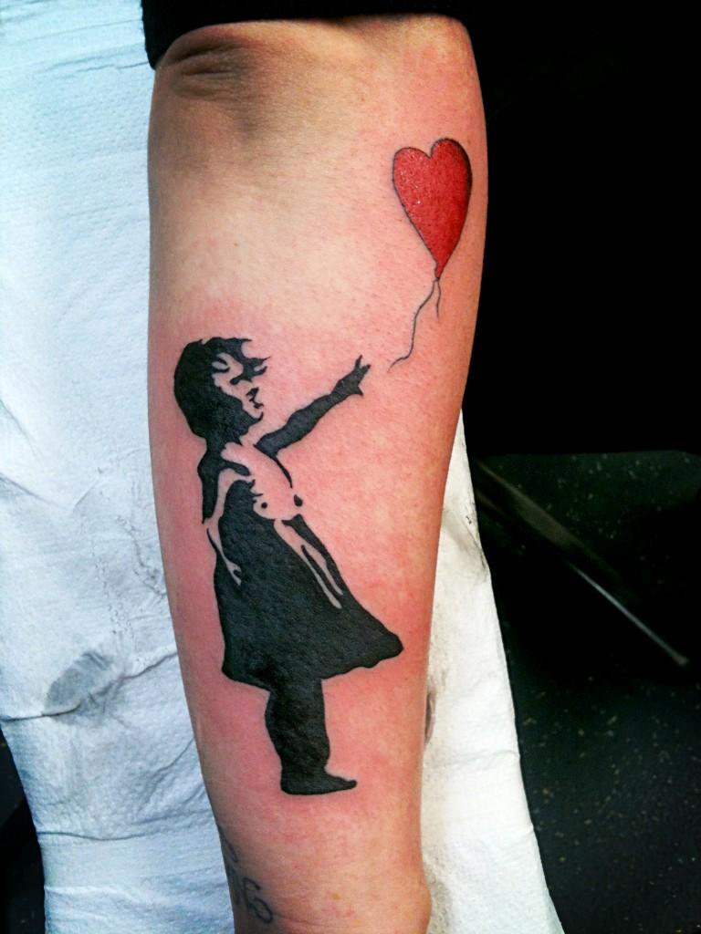 Black Banksy Girl With Red Heart Balloon Tattoo On Forearm