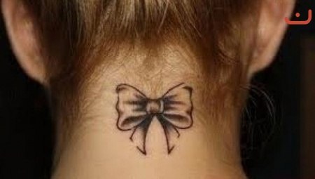 Black Bow Tattoo On Girl Back Neck