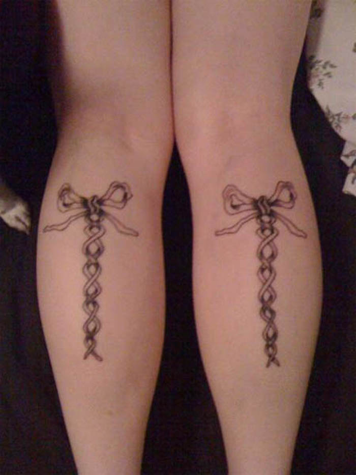 Black Corset Ribbon Bow Tattoo On Both Leg Calf