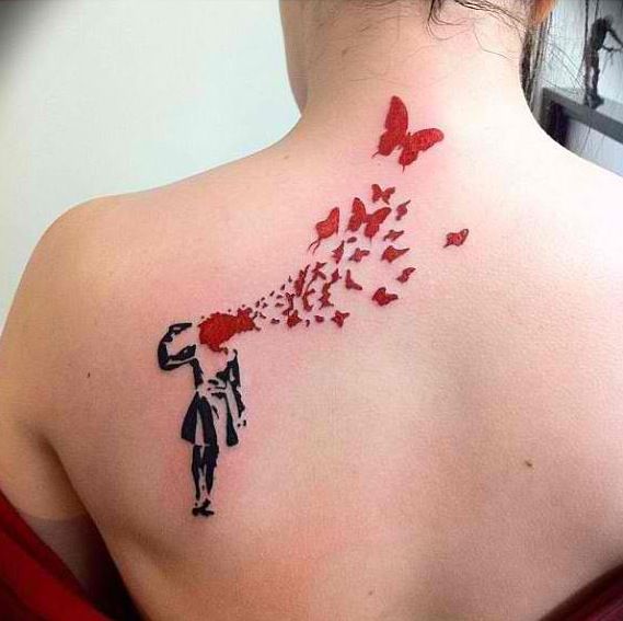 Black Gun On Banksy Girl Hand With Red Butterflies Tattoo On Girl Upper Back