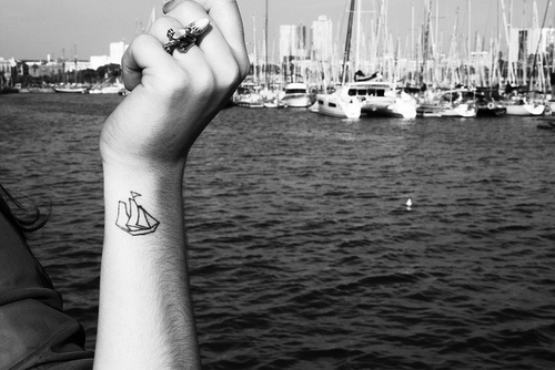 Black Little Boat Tattoo On Side Wrist