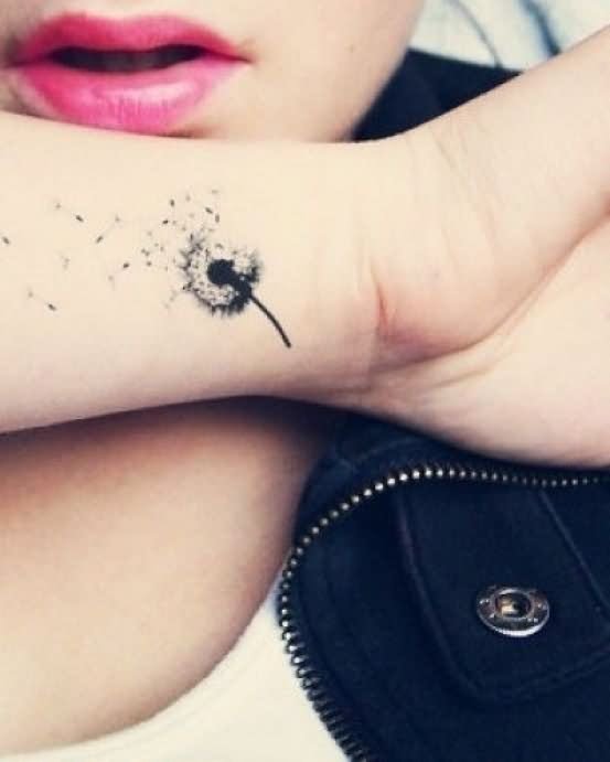 Black Little Dandelion Tattoo On Girl Wrist