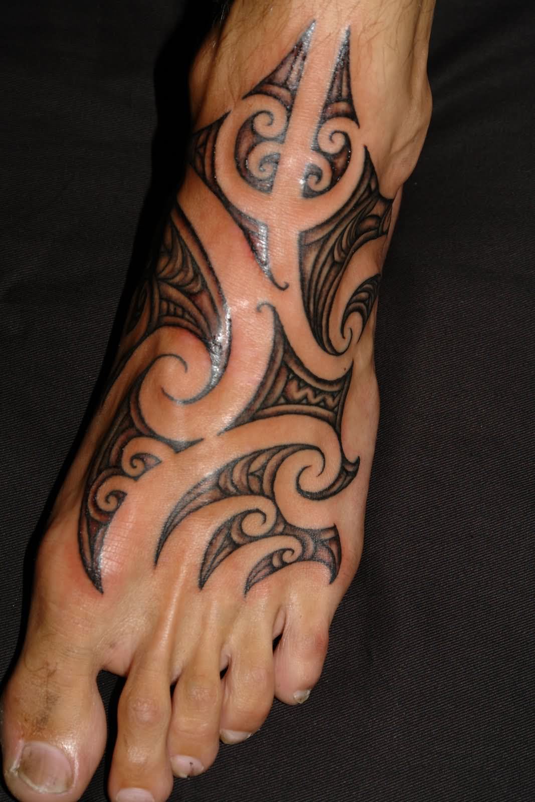 Black Maori Design Tattoo On Foot