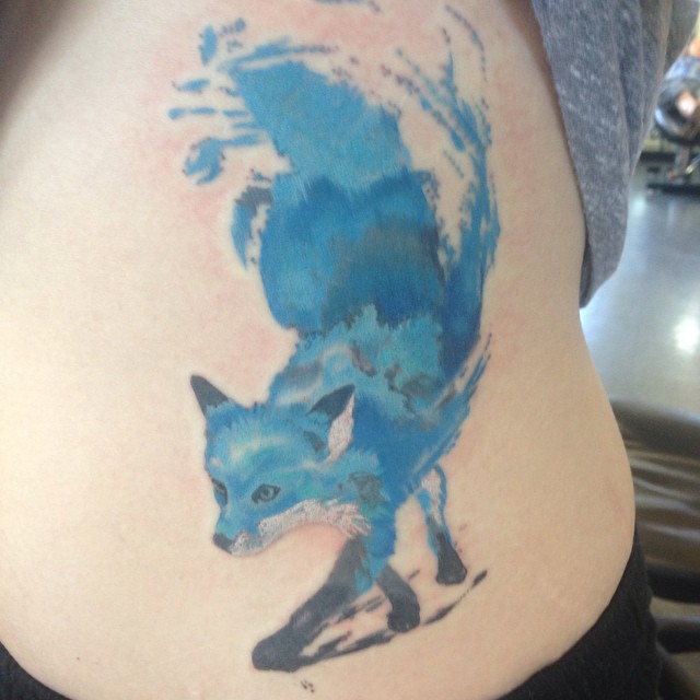 Blue Watercolor Tattoo On Side Rib