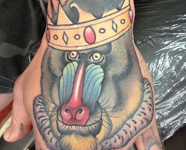 Colorful 3D Crown On Baboon Head Tattoo On Hand
