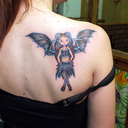 Colorful Banksy With Flying Wings Tattoo On Girl Right Back Shoulder