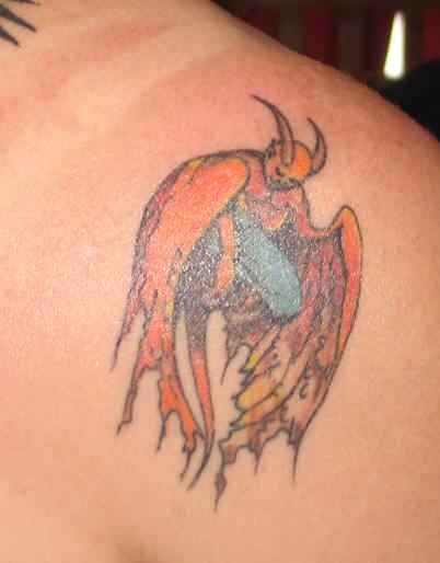 Colorful Demon Tattoo On Back Shoulder By Sharon