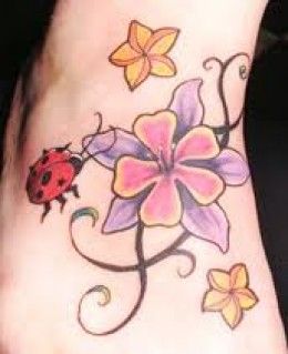 Colorful Flowers With Ladybird Tattoo On Foot