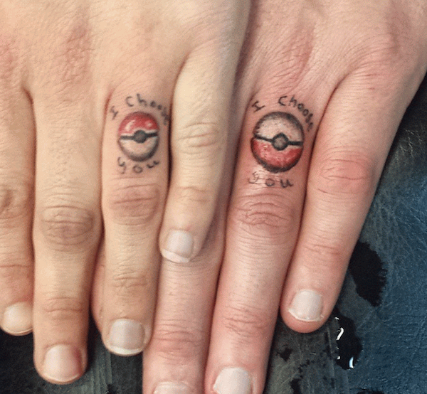 Colorful Pokemon Ball Ring Tattoo On Finger