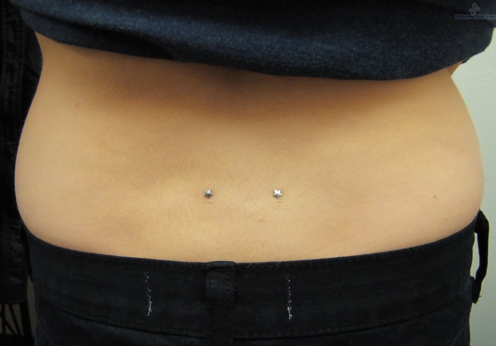 Dimple Lower Back Piercing With Star Dermals