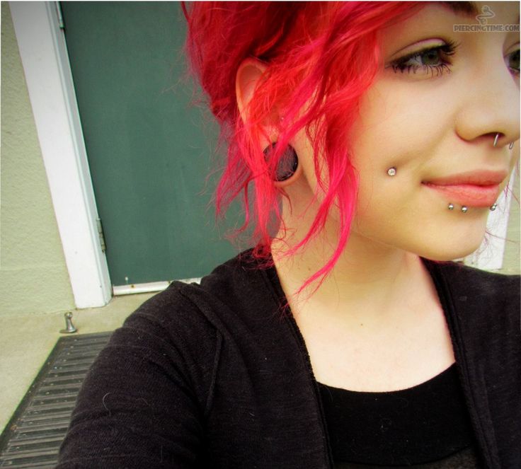 Girl showing Her Dimple Piercing