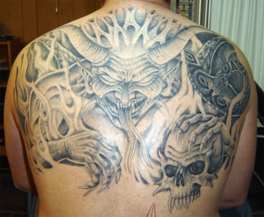 Grey Ink Skull In Demon Hand Tattoo On Upper Back By Darin Gonzales
