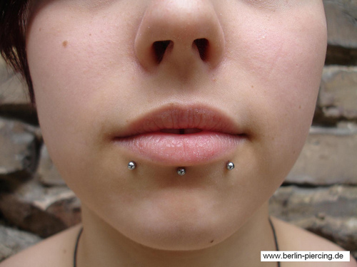 Labret And Snake Bites Piercing With Silver Studs