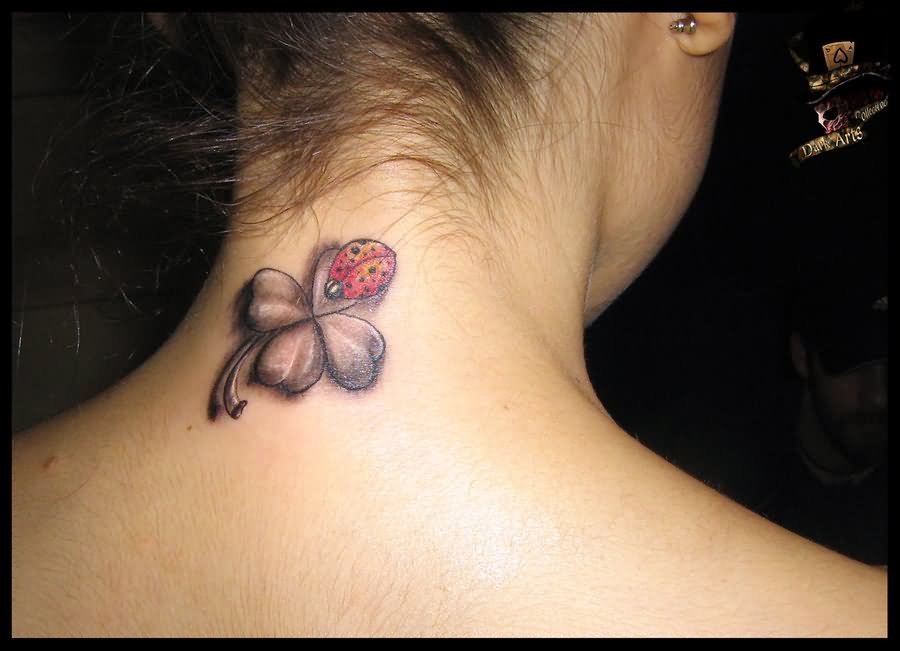 Ladybird On Clover Leave Tattoo On Girl Back Neck By Dark Tattoo