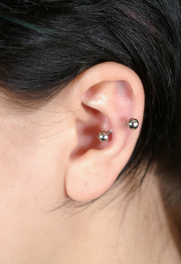 Left Ear Piercing With Silver Curved Barbell