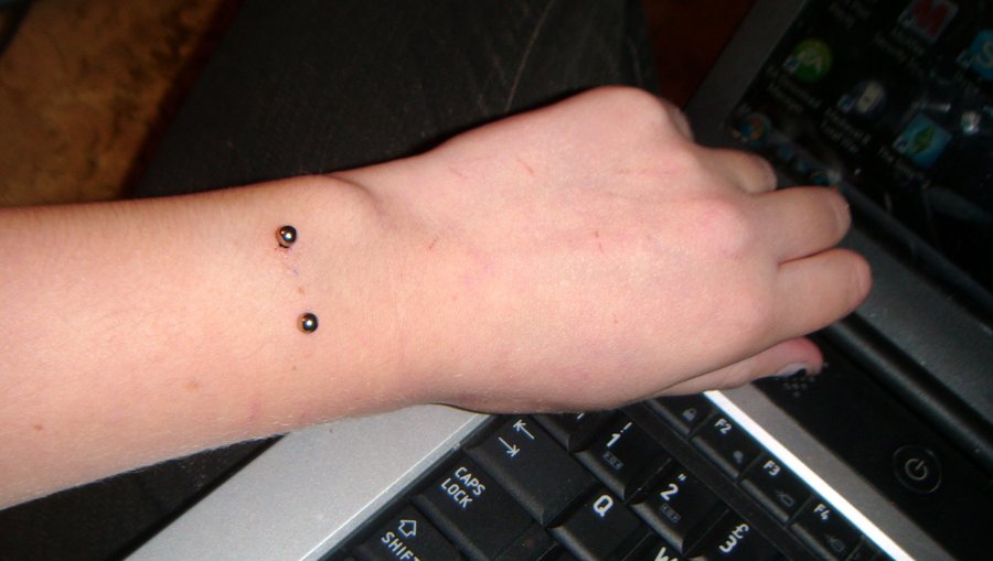 Left Wrist Piercing With Surface Barbell